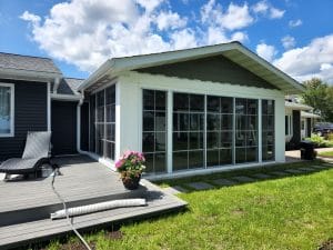 White 3-season vinyl sunroom addition designed for comfort and durability