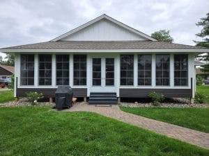 Spacious 3-season vinyl sunroom with panoramic outdoor views in Brainerd