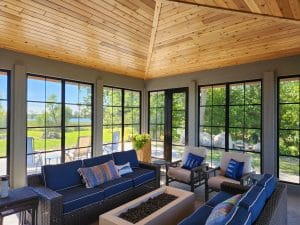 3-season vinyl sunroom addition with durable black framed glass windows