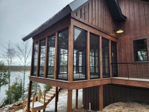 Custom-built 3-season vinyl sunroom with wrap-around windows in Minnesota