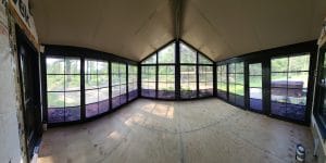 Bright 3-season sunroom with vinyl glass sliders opening to patio in Duluth