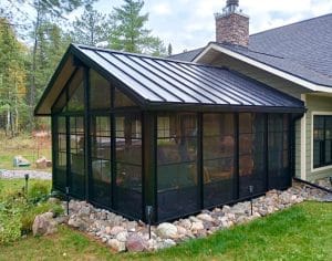 Modern 3-season sunroom with sliding vinyl windows and outdoor deck in Twin Cities