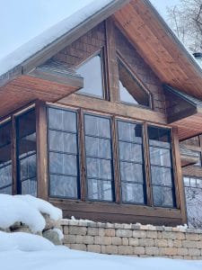 Vinyl 3-season sunroom surrounded by nature in Duluth, perfect for year-round comfort