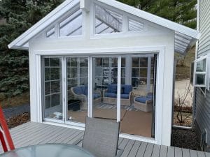 Contemporary white vinyl 3-season sunroom addition to Minnesota home