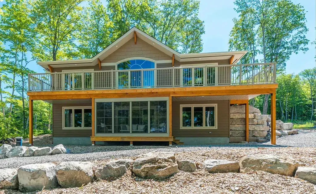 Raised Minnesota home with an enclosed room built beneath the upper deck