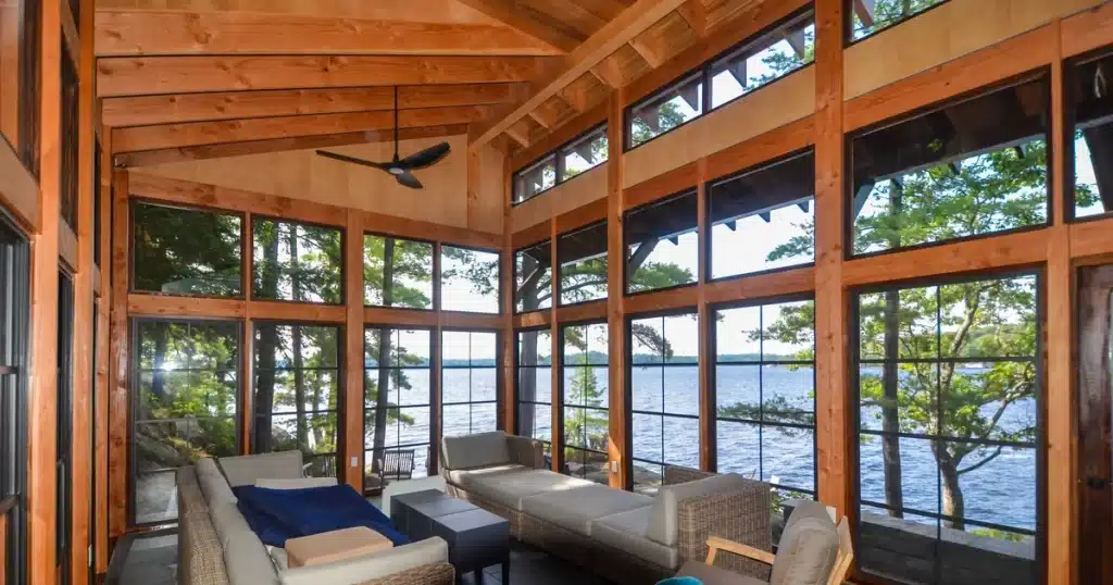 WeatherMaster windows enclosing a lake cabin porch with a clear view of the water