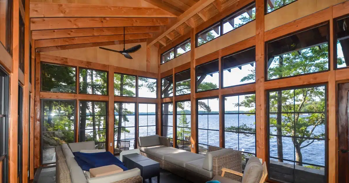 WeatherMaster windows enclosing a lake cabin porch with a clear view of the water