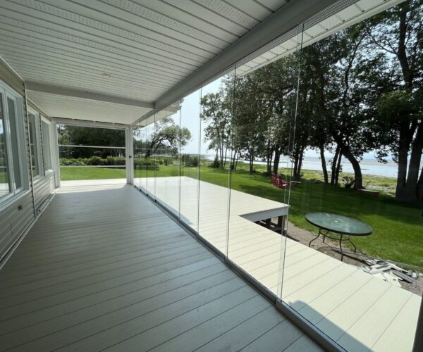 Spacious 3-season vinyl sunroom addition with panoramic windows and natural light