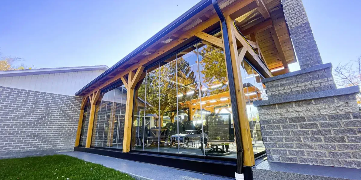 Closed Novasun Panoramic glass walls enclosing a timber-framed patio
