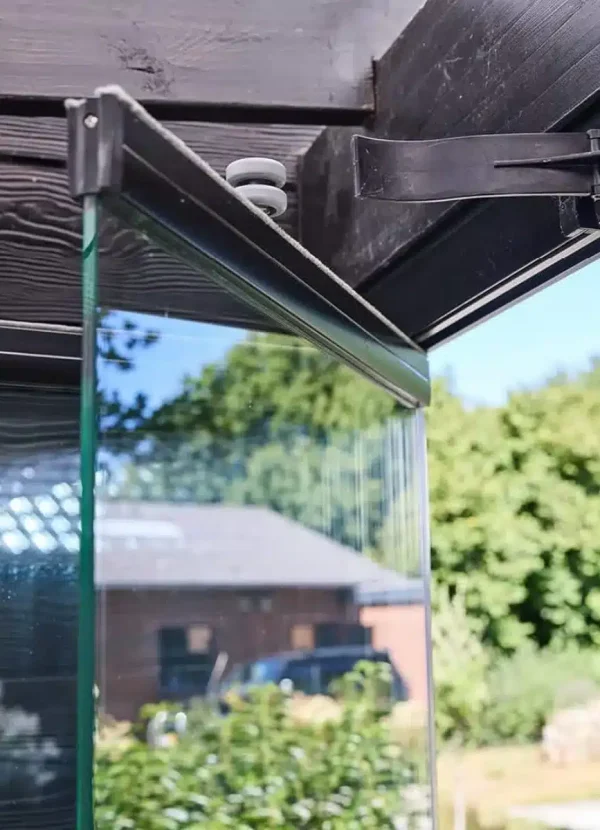 Close-up of a Novasun Panoramic glass panel pivoting beneath the top track