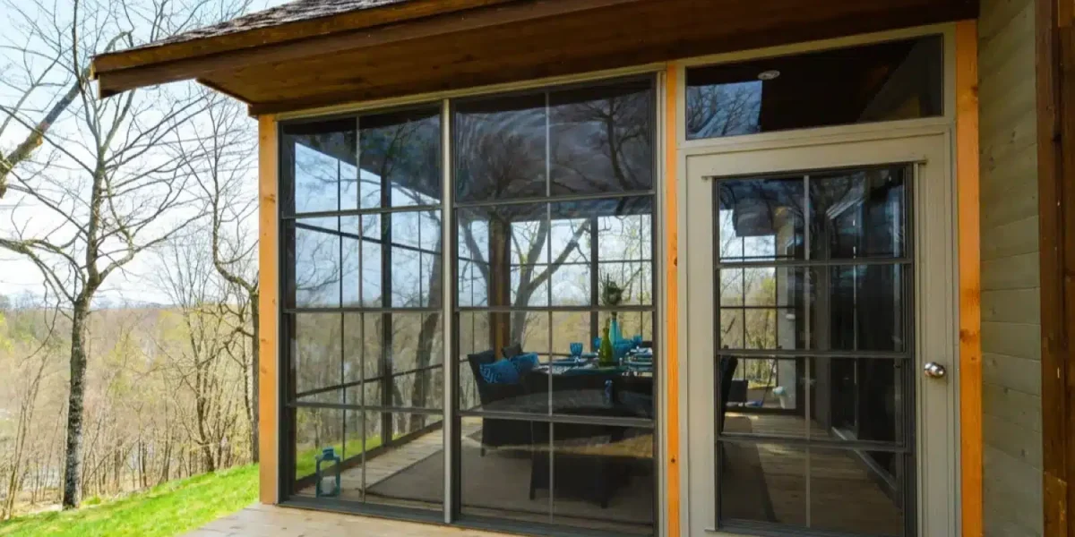 Exterior of a wood porch fitted with horizontal WeatherMaster windows and a matching door