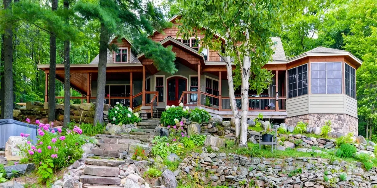 Cabin exterior with a WeatherMaster window enclosure built beneath the existing roof Dimensions: 1500 × 1000